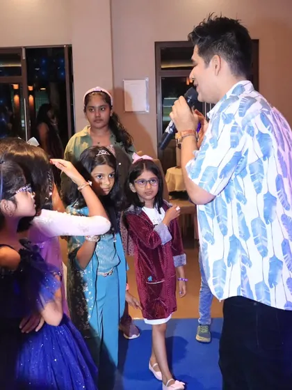 Another angle of me interacting with the children at the Frozen-themed event.