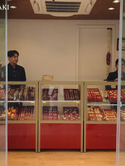 A look inside the Minaki kiosk, with staff ready to help you explore their collection of fine jewelry displayed in glass cases.