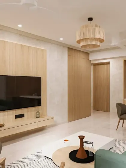 We create warm and inviting living spaces perfect for family time. This living room showcases a Japandi-inspired design with natural wood tones, a comfortable green sofa, and soft, ambient lighting, proving that modern home interiors can also be cozy and welcoming.