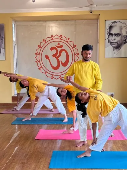 Our beginner classes are held in a bright and welcoming space, with portraits of our gurus, Swami Sivananda and Swami Vishnudevananda, creating a serene atmosphere for practice.