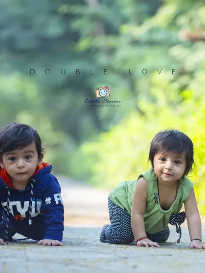 Capturing two little ones on the move. This photo of twin babies crawling side by side on a park path is a perfect example of the candid, action-filled moments I love to document.