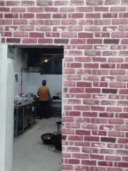 Another view of the red brick wallpaper in the commercial space.