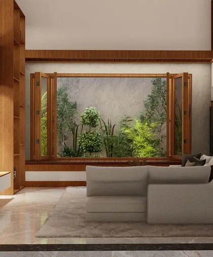 This view captures the serene and natural feel of the living space, with its earthy tones and view of the lush garden.