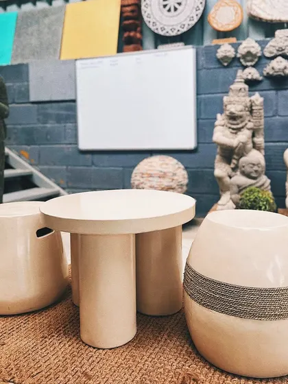 A sneak peek at some minimal outdoor furniture I'm curating, including sleek tables and stools.