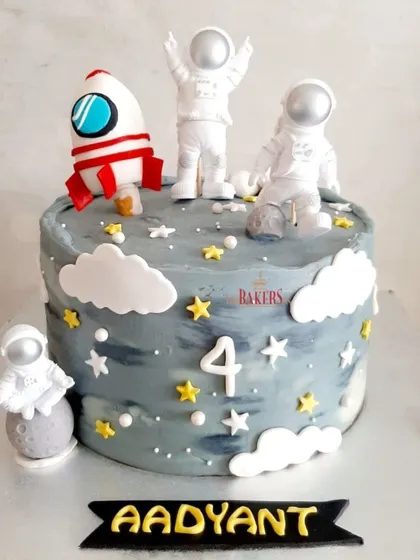 Aadyant is fascinated with space, and for the last two years, I've made him a space-themed cake. This minimal-fondant version features non-edible astronaut toys that he can play with later.