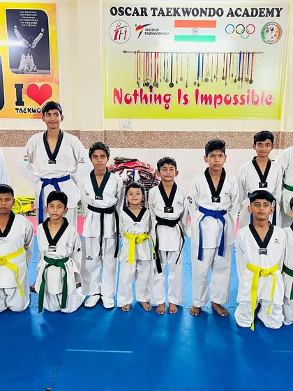 The team after a belt promotion test. Each new belt is a milestone earned through dedication and passing a rigorous exam.