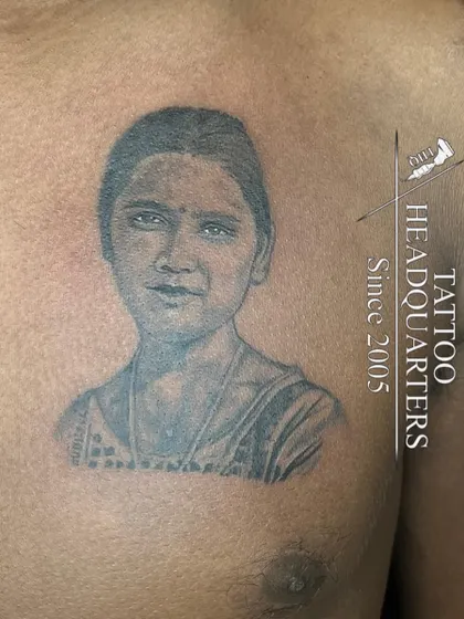A chest portrait tattoo that captures a striking resemblance. We work from photographs to create lasting tributes to loved ones.