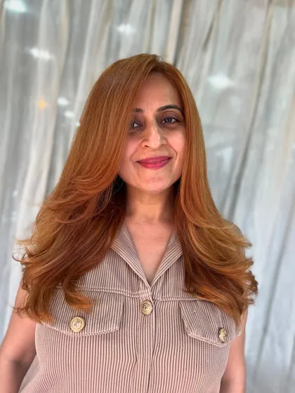 A bold, coppery blonde color paired with a fresh, layered cut. This look is all about creating a whole new, confident vibe.