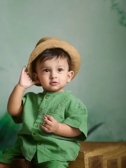 A curious expression captured in the studio. Indoor sessions allow for beautifully controlled lighting that really makes your child's features and personality shine.