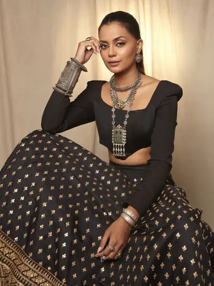 A full look from the oxidized jewelry campaign. The makeup is kept chic and minimal to allow the statement jewelry and the model's natural beauty to be the main focus.