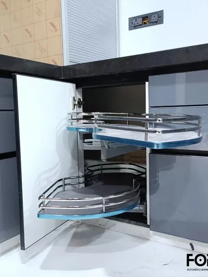This is our S-carousel corner solution, designed to bring the contents of your blind corner cabinet right out to you. The shelves swing out independently, providing easy access to items stored in the back.