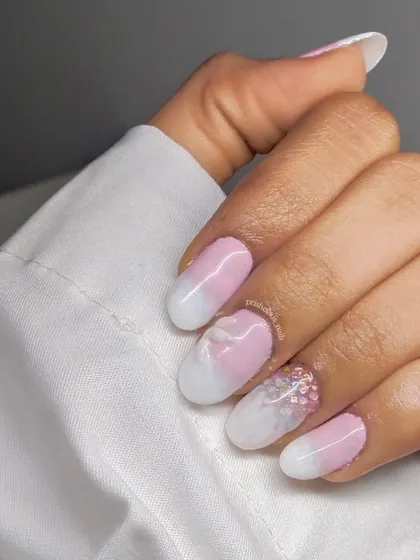 3D petal nails are so delicate and pretty. This design features an ombre of pink and white with sheer, layered petals and a touch of glitter for a soft, romantic look.