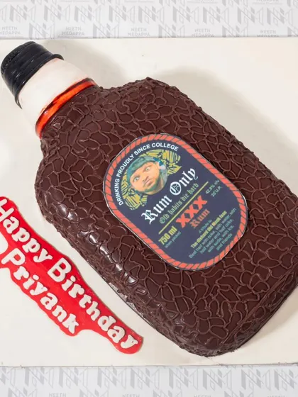 Cheers to another year! This fun cake is sculpted to look exactly like a bottle of Old Monk rum, making it the perfect inside joke for a birthday celebration.