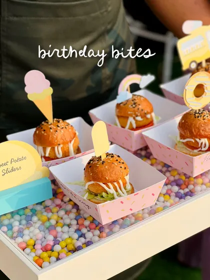 Another angle of the sweet potato sliders, showcasing the fun, colorful toppers.