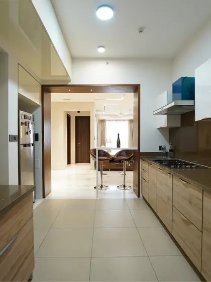 The parallel layout of this kitchen ensures an efficient workflow, with ample storage and counter space on both sides.