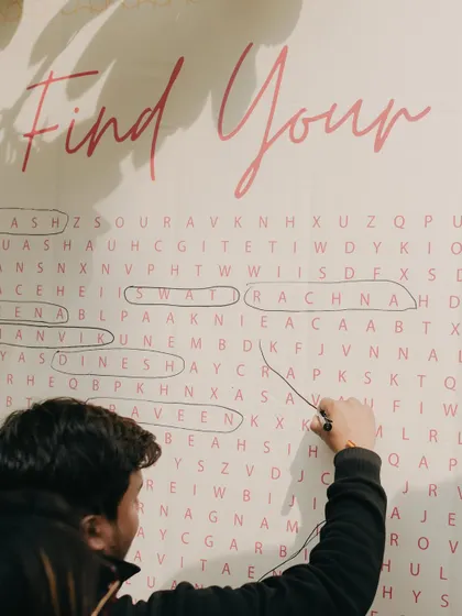 An interactive 'Find Your Name' word search puzzle for guests. We love creating fun and engaging activities that bring everyone together.