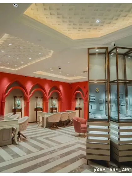 A view of the private consultation area at Batukbhai Jewellers, featuring vibrant coral walls with traditional archways. This design choice pays homage to Jaipur's craftsmanship while creating a memorable and energetic space for clients.
