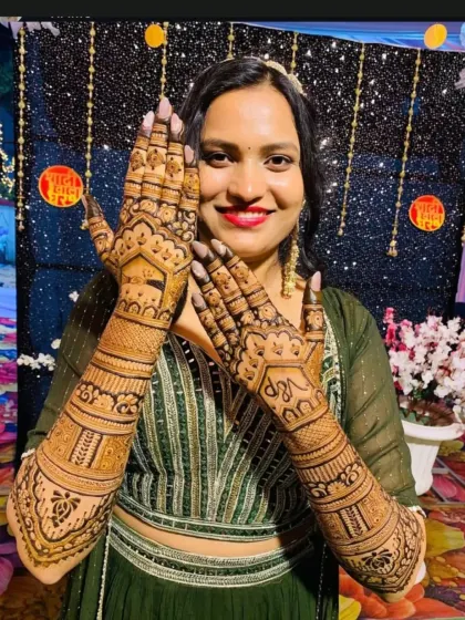 Another happy client proudly displaying her detailed wedding mehndi.