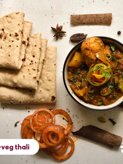 My non-veg thali is centered around succulent chicken dishes that change weekly. From Murgh Lababdar to home-style chicken curry, each bite is designed to transport you back home.