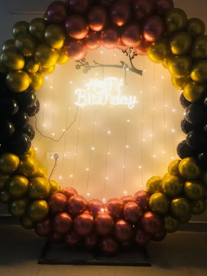A colorful balloon ring with gold, black, and rose gold balloons, showing another custom color combination I can create.