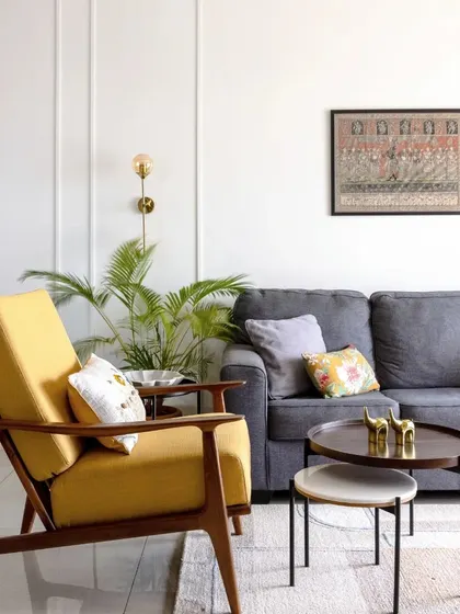 A repeat of the living room with the yellow accent chair.