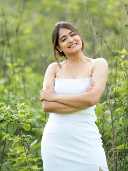 A candid moment of laughter, captured in a beautiful natural setting.