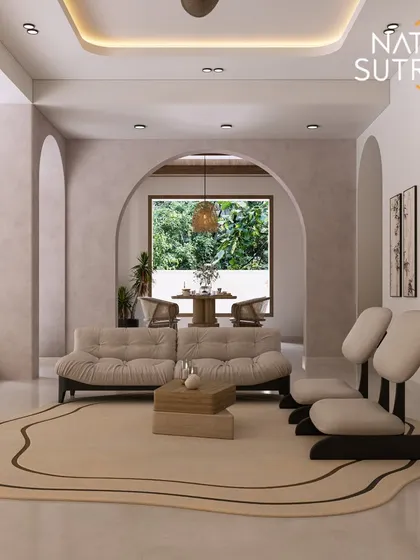 A wider view of the Mediterranean-inspired living room, showing the series of archways that create a soft, flowing transition between spaces. The irregularly shaped rug adds an organic, modern touch.