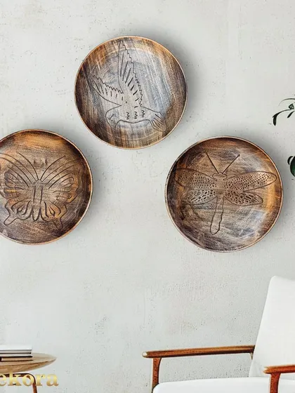 The subtle details and textures of these decorative plates make them a sophisticated addition to any wall.