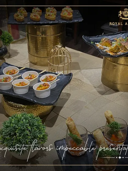 An assortment of my appetizers, including spring roll shooters and other canapés, displayed with elegant, modern serveware. This shows my focus on impeccable presentation.