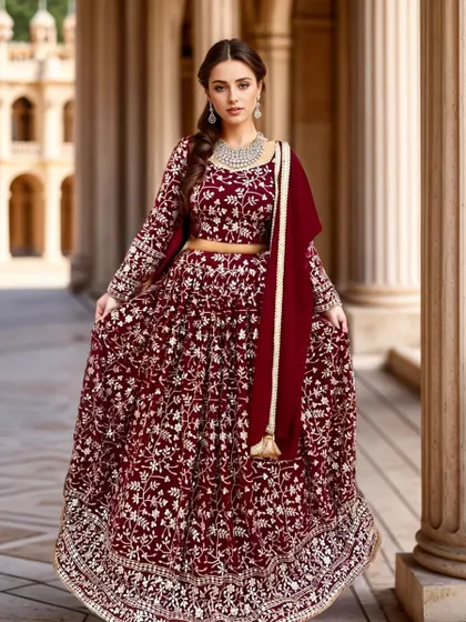 For the bride who loves classic elegance, this deep maroon velvet lehenga with intricate gold embroidery is a perfect choice. It's regal, timeless, and absolutely breathtaking.