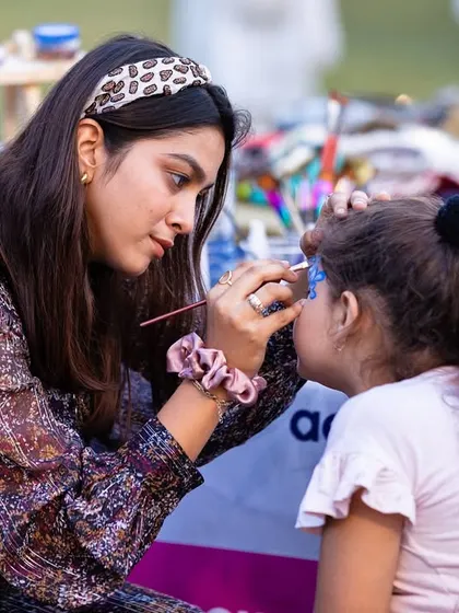 One of our artists focused on painting a design for a young client. We love these moments of quiet concentration.