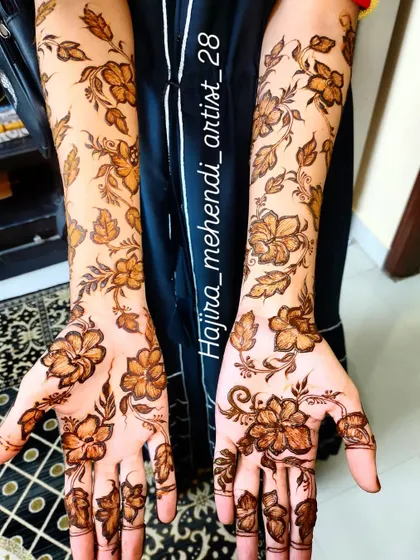 A close-up of the palms, where the floral vine pattern continues for a complete and cohesive design.