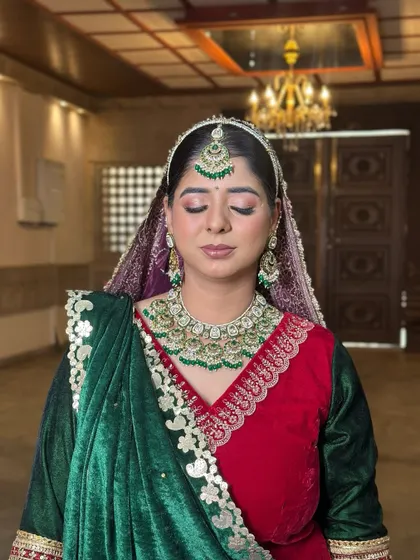 A close-up of the makeup. I used soft, shimmering tones on the eyes to complement the rich green and red of her outfit and the beautiful Kundan jewellery.