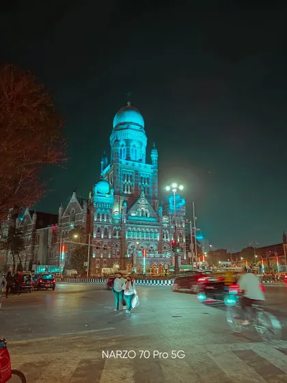 A night shot of the Mumbai Municipal Corporation Building, illuminated in blue light. Captured on the Narzo 70 Pro 5G, it shows the phone's ability to handle city nightscapes.