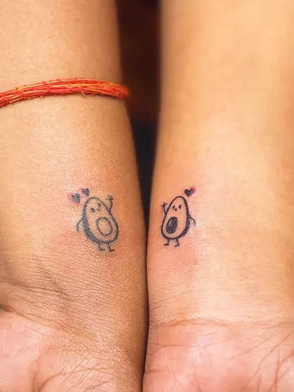 Cute matching avocado tattoos for a couple. A fun and quirky way to show your connection.