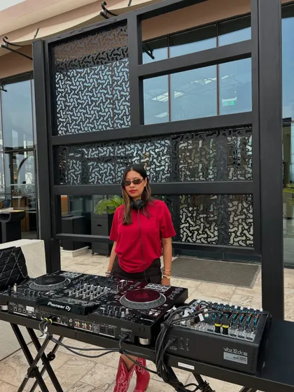 Standing confidently at my station, ready to start a set. This image conveys my professionalism and readiness to perform.