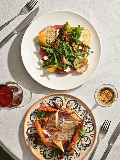 A fresh salad and a hearty main, perfectly paired for a balanced and delicious meal.