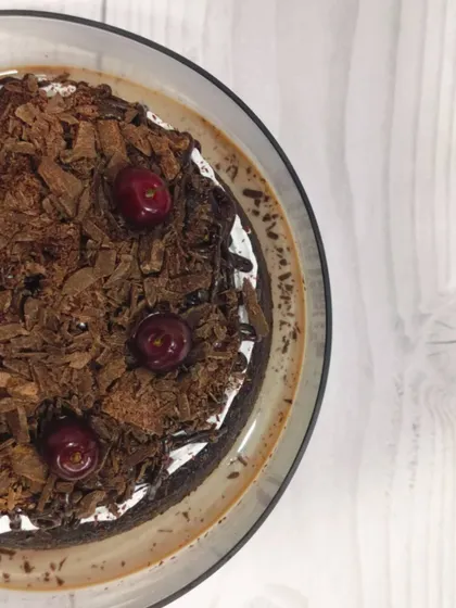 My take on a classic, this is the Black Forest Tres Leches. It features a rich chocolate sponge soaked in my signature milk blend, layered with cream, and topped with chocolate shavings and fresh cherries.