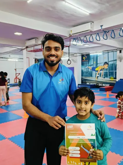 This young boy is excited to show off his "JUMP" program certificate.