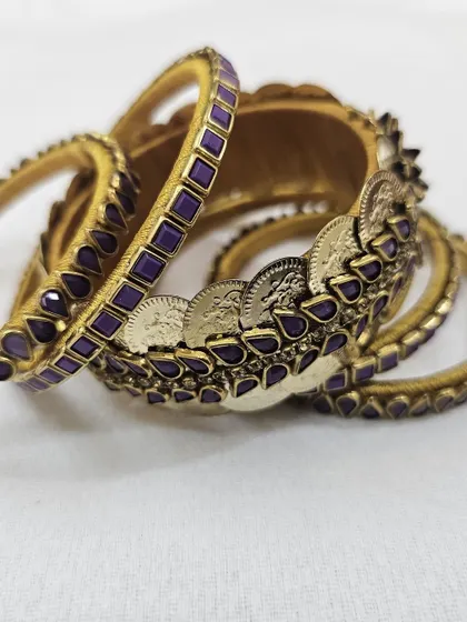 Another angle of the purple coin and kundan bangle set, highlighting its rich texture and traditional design elements.