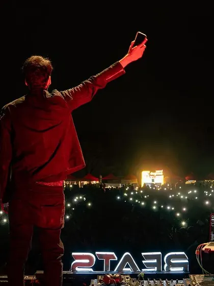 Another angle of the crowd selfie moment, showing the sea of lights.