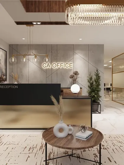 A focused shot of the CA Office reception desk. The combination of a brushed gold base, a black countertop, and a textured back wall creates a strong brand statement right at the entrance.