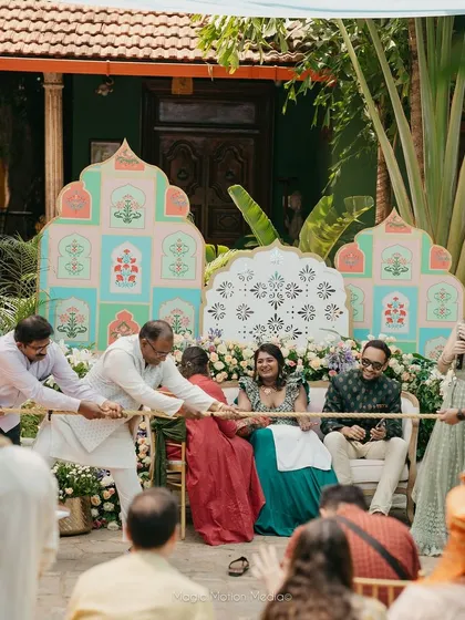 The full view of the pastel Mehendi backdrop, showing how the different elements come together to create a cohesive and beautiful stage.