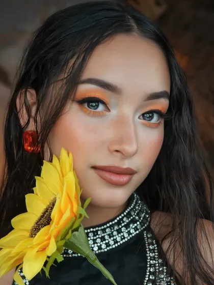 A softer take on the sunflower look, this image shows the beautiful blend of the orange eyeshadow with a natural, dewy base.