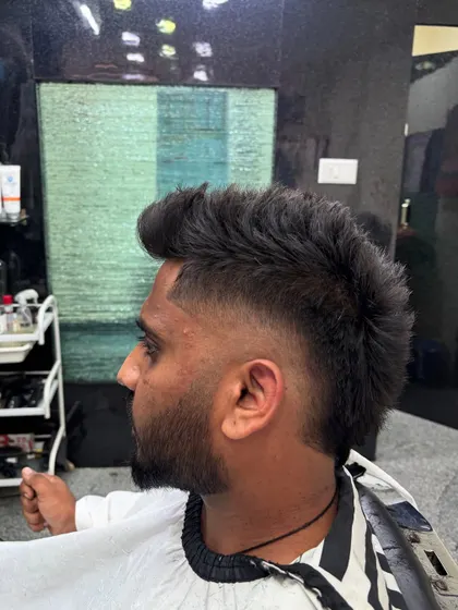 A perfect example of a burst fade. This style fades out behind the ear in a circular shape, creating a bold effect that works great with mohawks or textured tops.