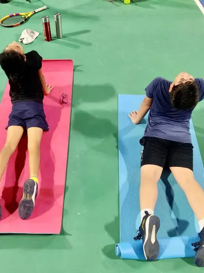Cooling down is just as important as warming up. After a tough session, we guide our players through essential stretches to aid muscle recovery and improve flexibility.