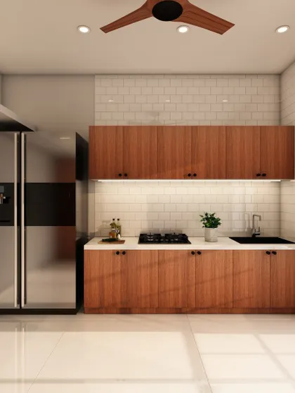 The other side of the minimalist kitchen, showing the seamless integration of the refrigerator and the clean lines of the cabinetry.