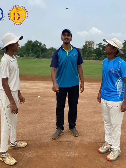 A coach tosses the coin before a match at Don Bosco Academy, Nerul. This moment signifies the start of a fair and competitive game, a core value we teach our students.