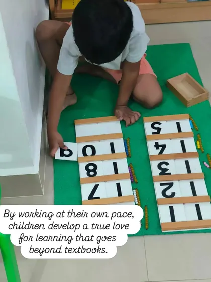 By working at their own pace, children develop a true love for learning that goes beyond textbooks. This child is using the teens and tens boards to understand the decimal system in a concrete way.