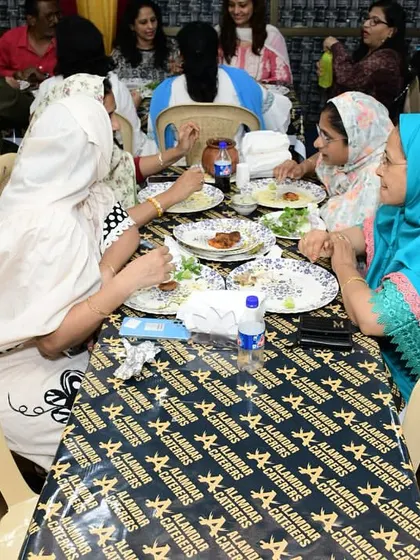 Ladies from the Bohra community enjoying conversation and good food at our venue.